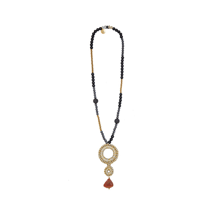 Long necklace in mixed metal tones with gemstones, and drop of hand crocheted circles and carnelian gemstone. Featuring lava, onyx and hematite-mixed metal neutral tones.