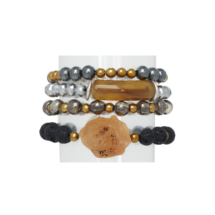 A stack of 4 bracelets in mixed metal tones, carnelian, lava, hematite, ceramic and acrylic horn-like beads.