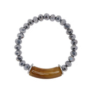Bracelet with acrylic horn-like focal bead, silver plated zamak discs and silver tone crystal cut glass beads