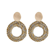 Pair of front facing statement hand crocheted hoops in mixed metal tones, with oval gold tone earring posts