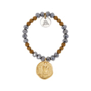 Bracelet with silver tone plated crystal cut glass beads, gold tone plated hematite beads, gold plated coin and silver plated Goddess charm