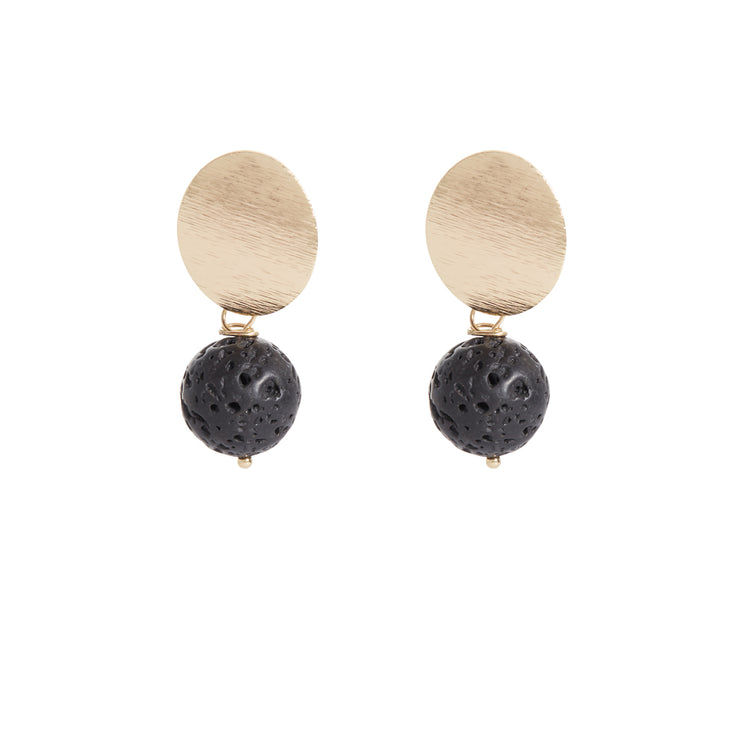 A pair of earrings in gold tones with black lava dangle with oval gold plated posts
