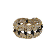 Chunky hand crocheted bracelet with gold and black metallic thread over black chain.