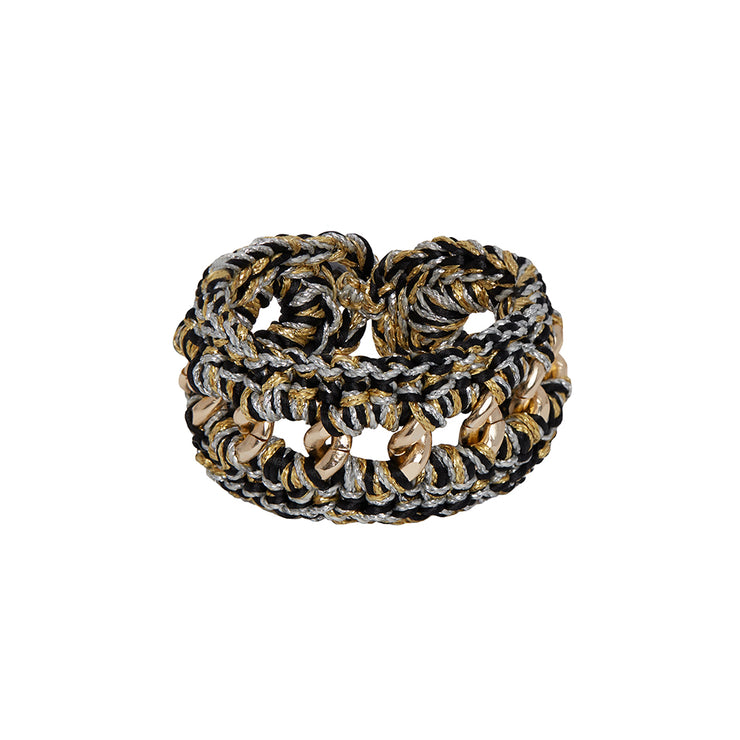 Chunky hand crocheted bracelet where  gold tone chain meets black, silver and and gold tones.